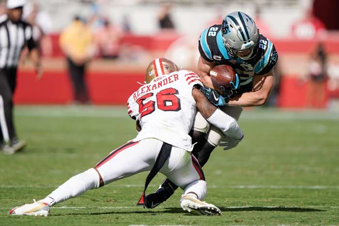 Oct 27, 2019; Santa Clara, CA, USA; San Francisco 49ers middle linebacker Kwon Alexander (56) tackles Carolina Panthers running back Christian McCaffrey (22) during the second quarter at Levi's Stadium. Mandatory Credit: Stan Szeto-USA TODAY